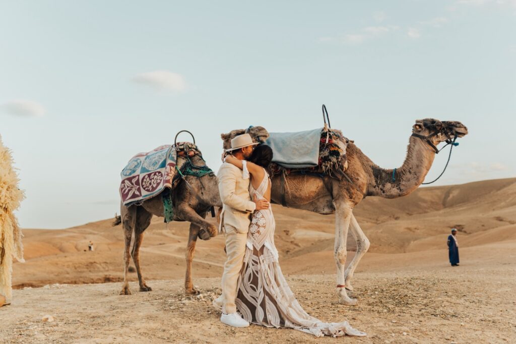 Couple with camels during their elopement wedding in Marrakech