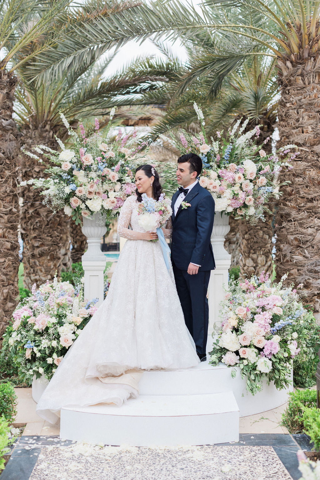 The bride and groom portraits outside of their luxury Marrakech wedding venue